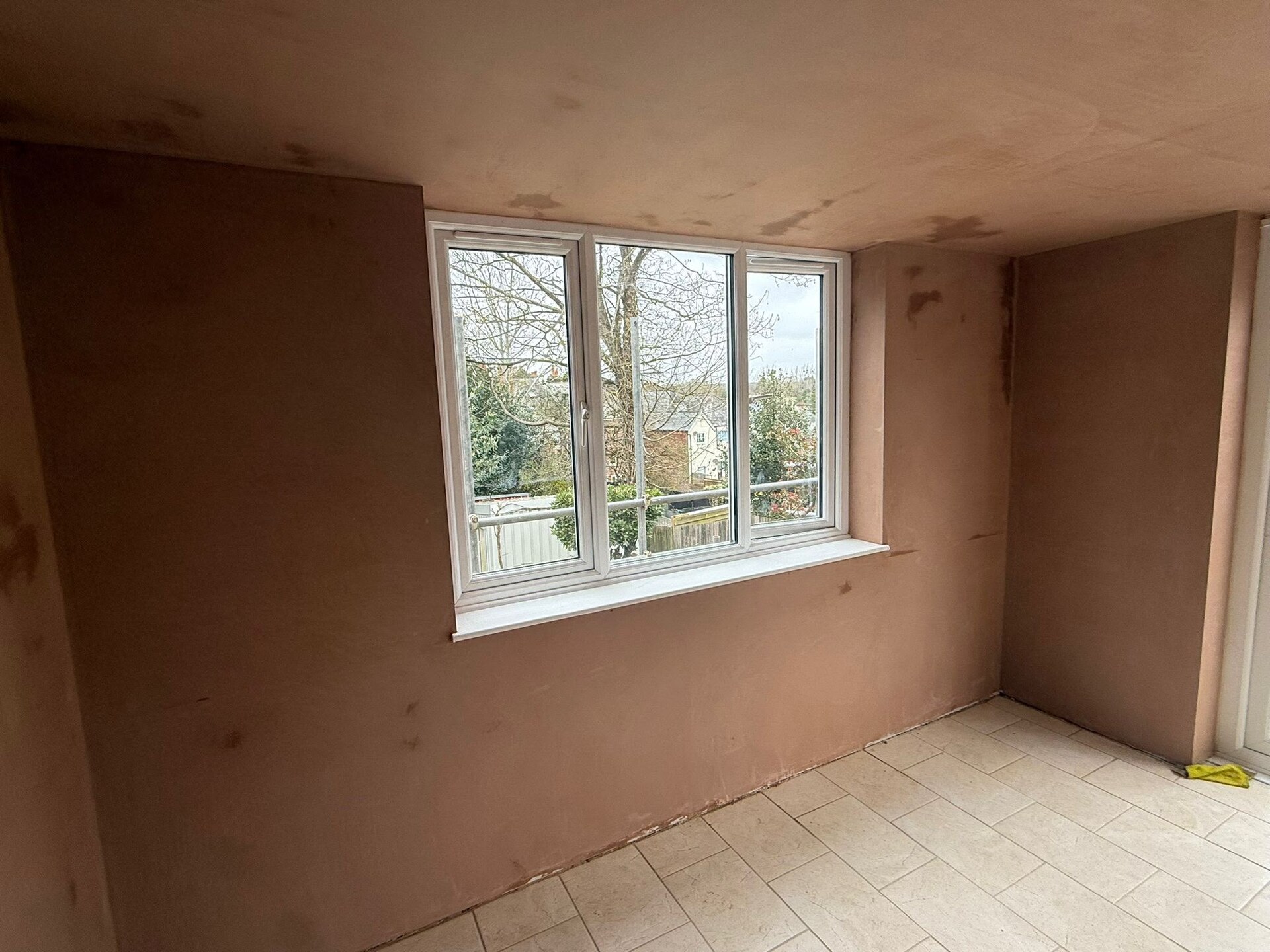 A plaster repair blended into an existing wall